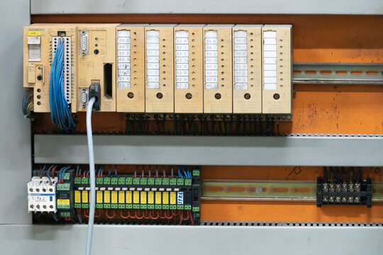 old SIMATIC S5-95U model type PLC of SIEMENS which installed inside the electrical cabinet, illustrative editorial image.