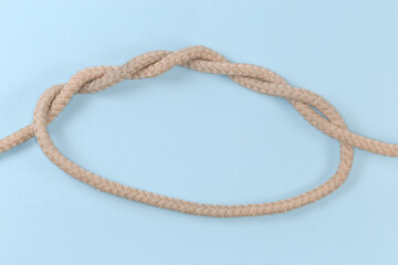 Rope knot Threefold overhand knot on a blue background