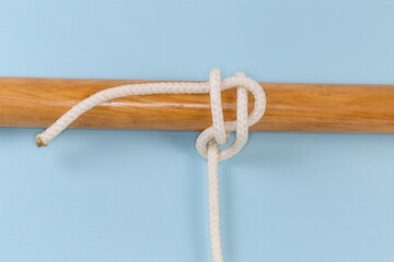 Rope knot Studding-sail bend tied around a wooden pole