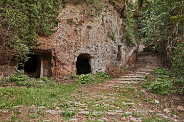 Barbarano Romano, Viterbo, Lazio, Italy: path with caves and staircase at the base of the ancient village on the hill in the Marturanum regional park