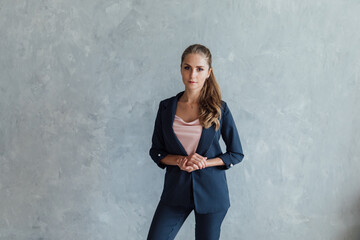 a woman in a business suit in an office space in an office business room