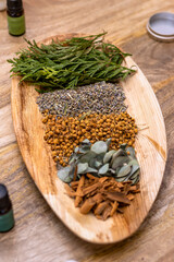 Soy candle creation workshop. Tray with flowers and fruits to decorate candles.