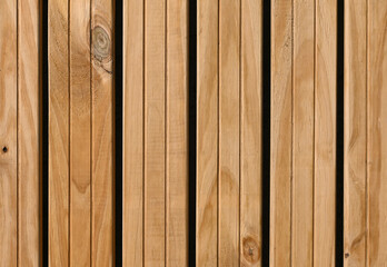 Fondo con detalle y textura de varios listones de madera con lineas y tonos marrones