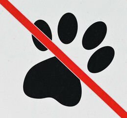 Fondo con detalle de señalización de prohibido mascotas, con huella de animal y linea roja de...