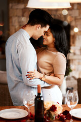 Love, wine and romance, happy couple dance on valentines day date at home with smile and bokeh. Date night, man and woman hug in living room, romantic valentine celebration and relationship together.