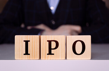 The word "IPO" written on wood cube. Business concept, Initial, Public, Offering