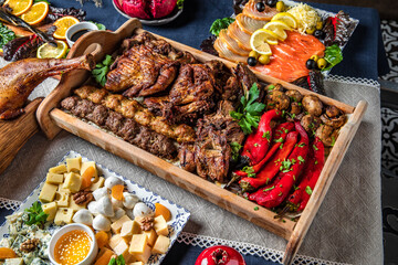 Food Table Celebration Delicious Party Meal Concept. A lot of meat, chicken, lamb, beef.  Foodset...