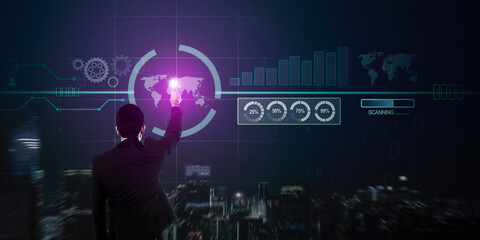 Back view of businessman working with virtual panel