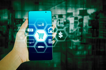 Hand holding a mobile phone with Virtual icon interface for shopping online