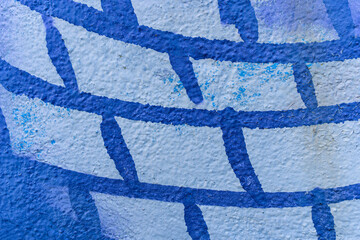 urban street art in painting on the wall aerosol graffiti in shape of net or bricks, netting...