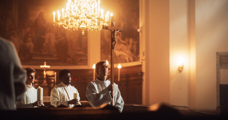Liturgy In Church: Procession Of Ministers, Bearing Holy Cross from Altar. Christians Rejoice In...