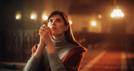 Front View: Christian Woman on her Knees in Front of Altar Starting to Pray in Church. Devoted...