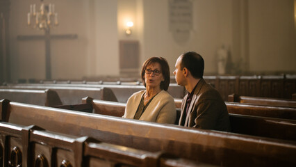 Portrait of Young Man and Old Woman Talking and Discussing While Sitting in a Church. Faithful...