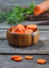 Food background with carrot on wooden table