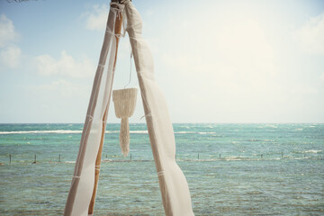 Tropical beach cabana; sun shade, Mexican Riviera resort vacation view of the ocean, relaxing beach