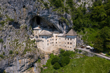 Fototapeta na wymiar Predjama Castle in Slovenia, Europe. Renaissance castle built within a cave mouth in south central Slovenia, in the historical region of Inner Carniola. It is located in the village of Predjama