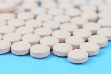 White round pill for healthcare. Medical treatment