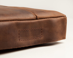 Bandmade brown leather seat cushion with hook-and-loop fastener