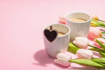 Valentine's Day romantic concept. Morning coffee, a bouquet of tulips, symbolic decor