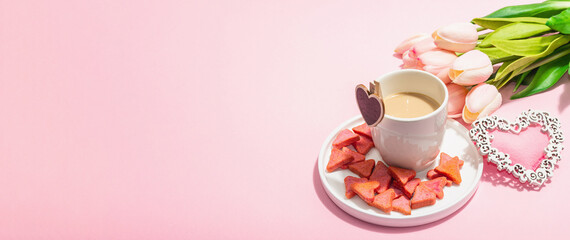 Valentine's Day romantic concept. Morning coffee, a bouquet of tulips, symbolic decor