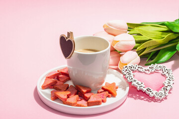 Valentine's Day romantic concept. Morning coffee, a bouquet of tulips, symbolic decor