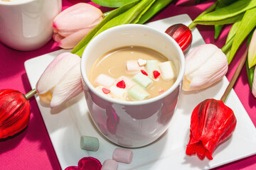 Valentine's Day romantic concept. Coffee with marshmallows, tulips flowers, traditional design