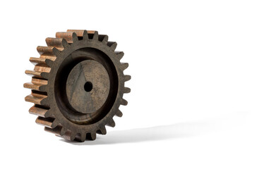 Wooden cog rolling on white background