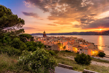 Fototapeta na wymiar Scenic view of Saint Tropez in summer sunset light and city lights turned on