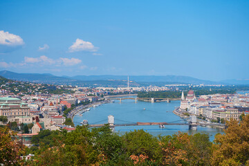 Fototapeta premium A street tap with clean water is built into the fence of the old town