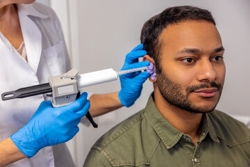 ENT doctor examining the patient with the medical apparatus