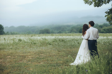 Fototapeta premium Happy young bride in a white dress. Bride and groom. Beautiful young couple man and woman. Wedding.