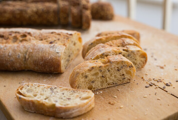 fresh loaf of bread on wooden board