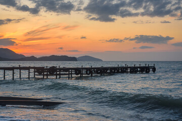 Obraz premium Wooden pier in sea at sunrise. Koktebel. Crimea