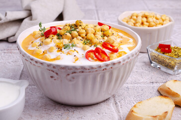 Fototapeta na wymiar Creamy vegetable soup with chickpeas