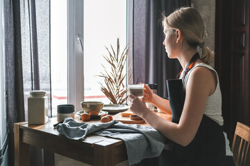 girl is preparing food dinner in the kitchen of her cozy home.home cooking, at home dining Slow cooking, comfort, mood. Slow moments of life, wellness and self love