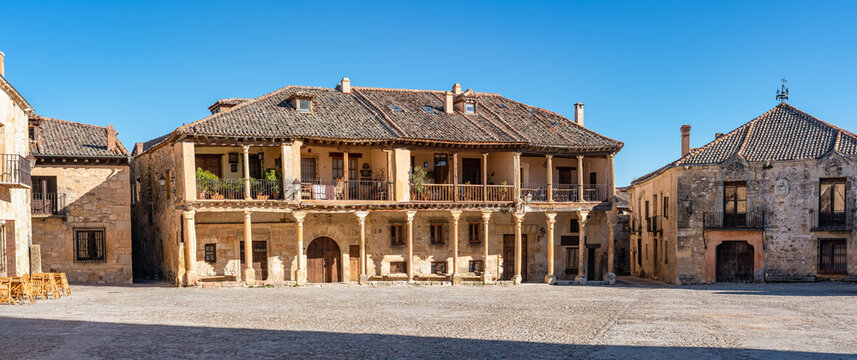 Main square of the city of Pedraza with its medieval buildings supported with wooden columns and balconies, Segovia, Spain.