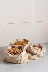 zero waste packaging. Pasta and nuts in paper bags on the table