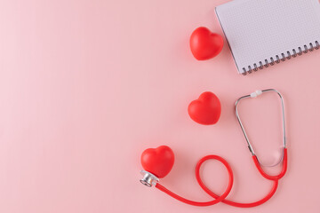 Fototapeta premium Doctors Day or World Health Day concept for background with stethoscope, red heart and checklist