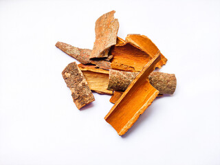 Cassia bark or chinese cinnamon or dalchini spice isolated on white background.