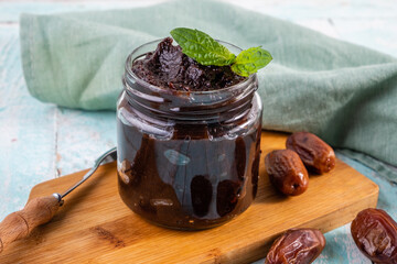 Creamy date paste, homemade in a glass jar.