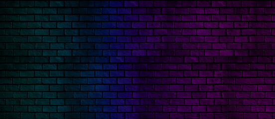 Fototapeta na wymiar Abstract panorama of brick wall with blue and pink neon light for pattern background. Basic dark and color background concept.