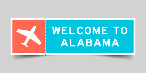 Orange and blue color ticket with plane icon and word welcome to alabama on gray background