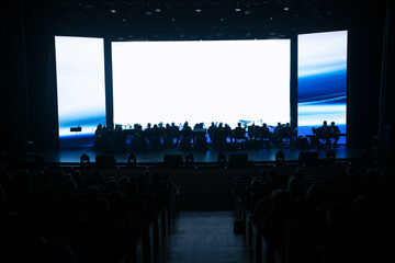 Symphony orchestra on the background of blurred spectators. © Светлана Лазаренко
