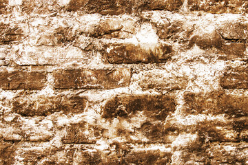 Brown brick wall. Horizontal decorative uneven blocks background. Urban architecture texture. Solid stone texture. Grunge brickwork structure.