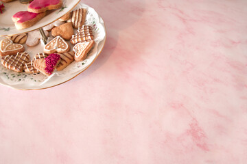 Fototapeta na wymiar Valentine's heart shaped biscuits copy space pink back ground 