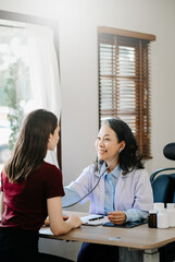 The doctor using a stethoscope checking patient with examining, Healthcare and medical concept..