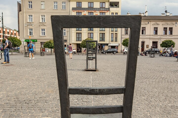 Ghetto heroes square with lots of symbolic chairs in Krakow, Poland