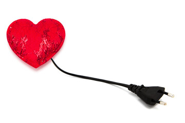 Red heart connected to cable with socket for charging isolated on white background.	