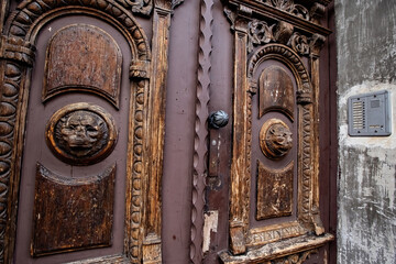 Old wooden carved door in the historical center of Krakow, Poland
