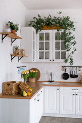 Fototapeta na wymiar Modern Kitchen Interior with Island, Sink, Cabinets, and Big Window in New Luxury Home.